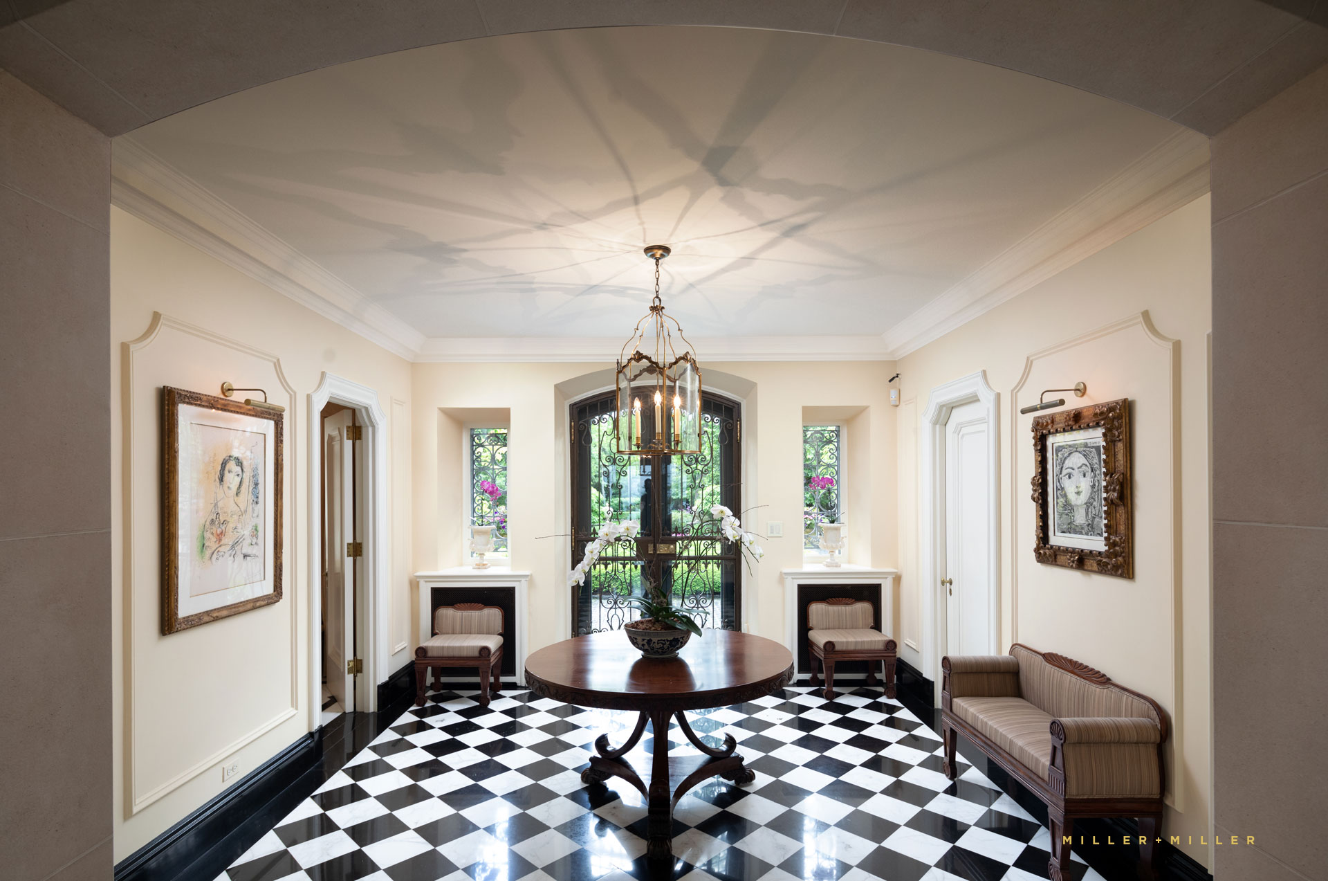 interior estate reception foyer art gallery black white checkered tile