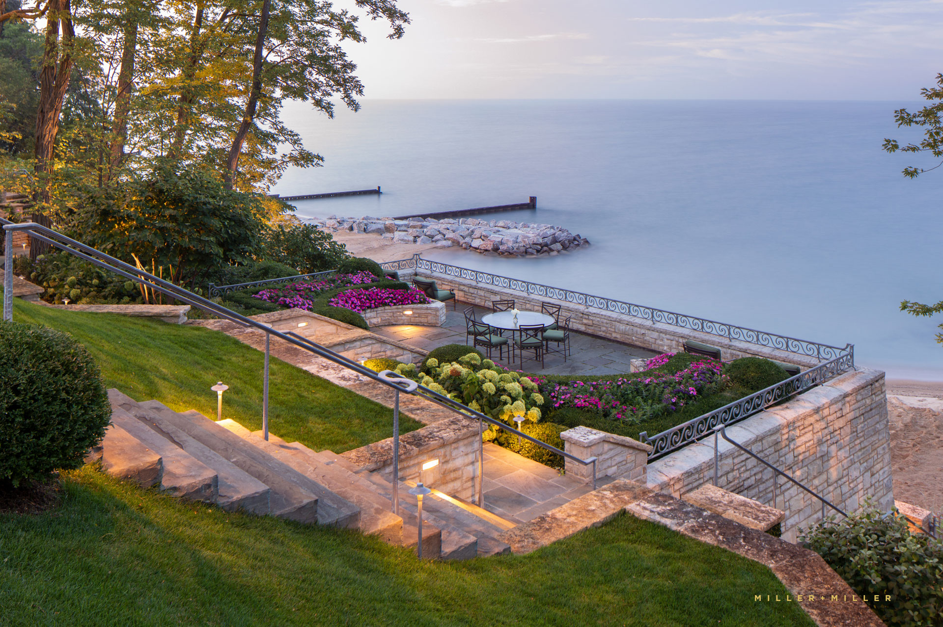 Winnetka Waterfront Residence Exterior Gardens Private Lake Michigan Bluestone Terrace Garden Sunset North Shore Chicago Luxury Mansion Home Photography Gated Private Landscaping Harbor Rock Wall Landscape Overlook